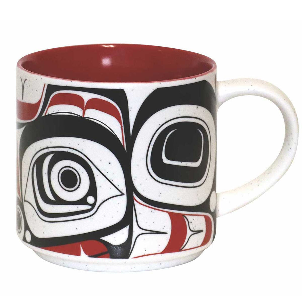 A ceramic coffee mug featuring an Indigenous design of eagles from the Bella Bella tribe