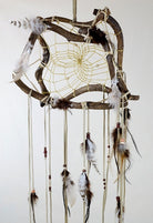12" The Wanderer Dream Catcher with green feathers. Twig sizes will vary due to the organic nature of the material.
