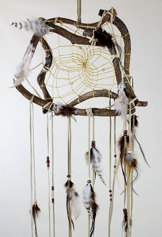 12" The Wanderer Dream Catcher with green feathers. Twig sizes will vary due to the organic nature of the material.