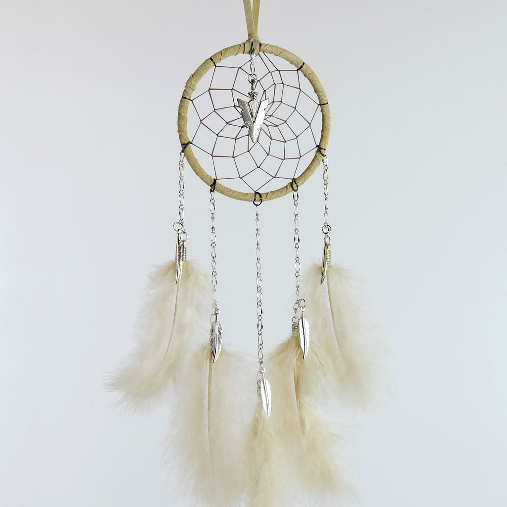 Handmade dream catcher with chain dangles detailed with metal feather charms and a metal arrowhead in the middle of the web.