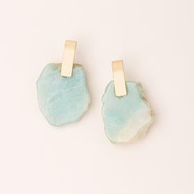 Scout jewelry featuring a pair of polished stone earrings