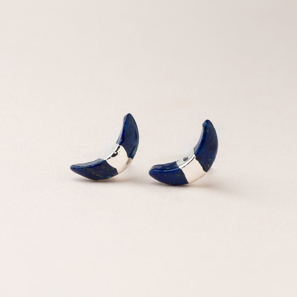 Scout jewelry featuring a pair of stud earrings