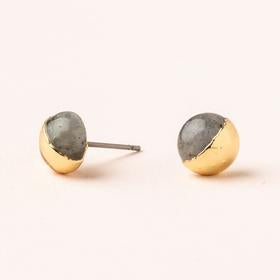 Scout jewelry featuring a pair of stud earrings