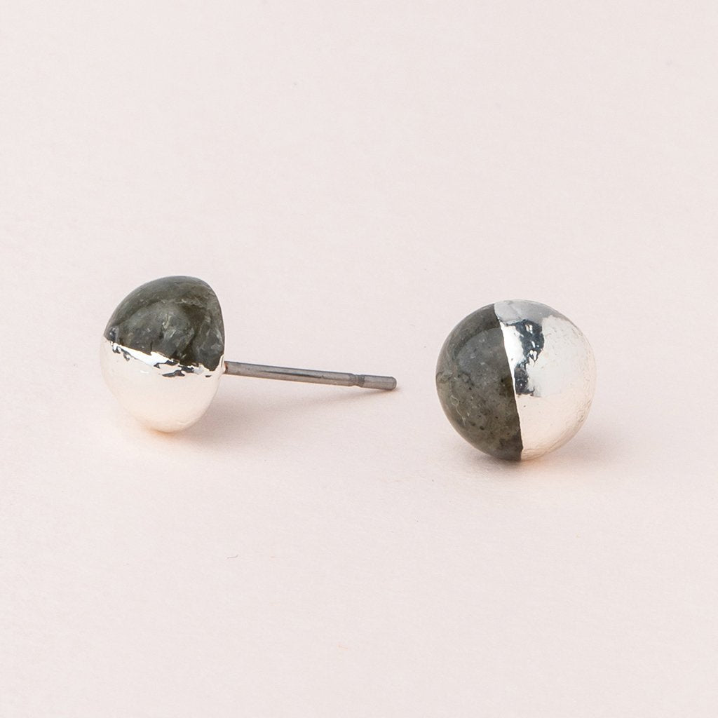 Scout jewelry featuring a pair of stud earrings