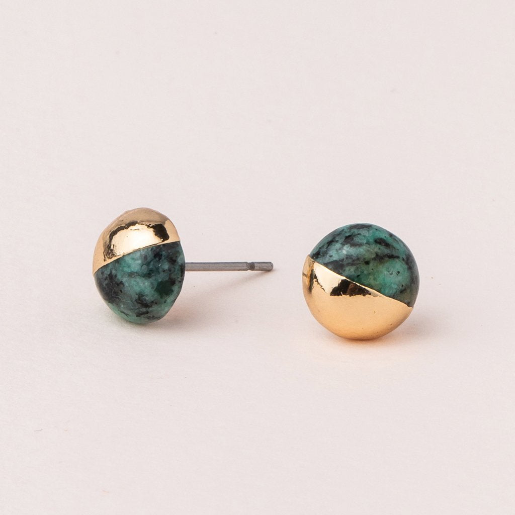 Scout jewelry featuring a pair of stud earrings