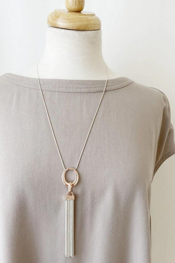 Caracol jewelry featuring a long adjustable multi chain tassel necklace