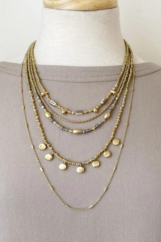 Caracol jewelry featuring a multi layered necklace