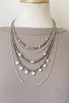Caracol jewelry featuring a multi layered necklace