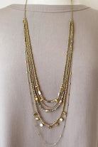 Caracol jewelry featuring a multi layered necklace