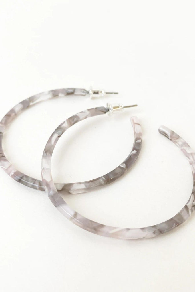 Caracol jewelry featuring a pair of medium sized multi coloured hoop earrings