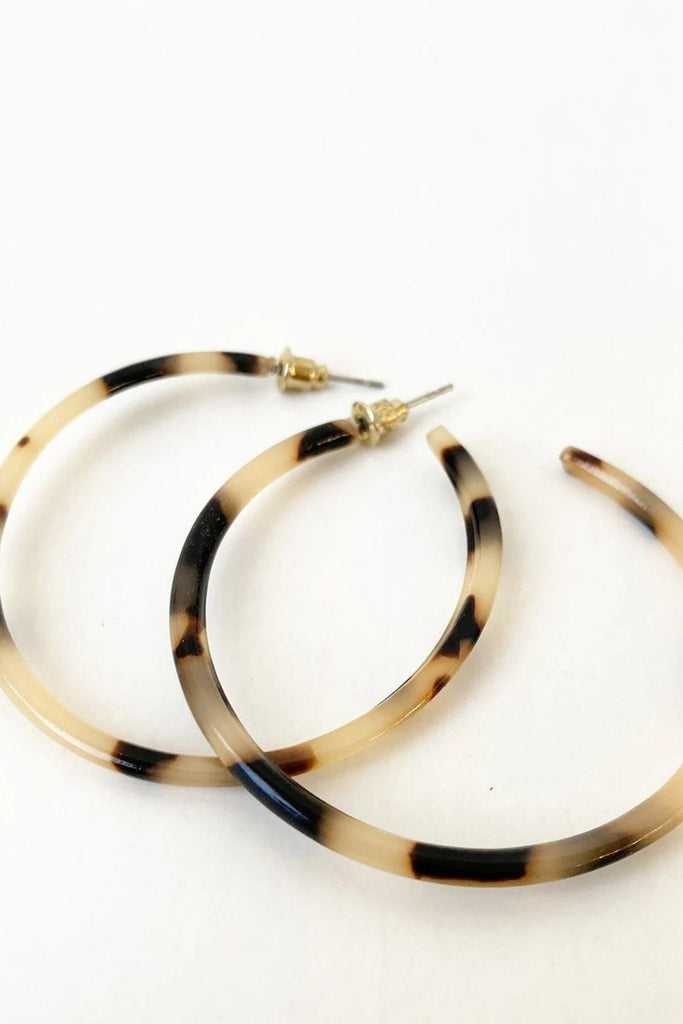 Caracol jewelry featuring a pair of medium sized multi coloured hoop earrings