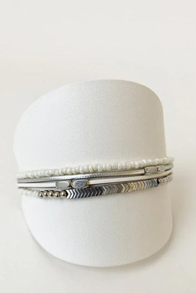 Caracol jewelry featuring a delicate single multistrand bracelet with metal beads. 