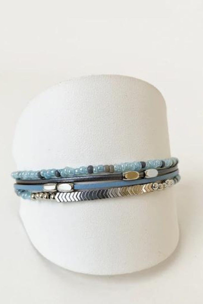 Caracol jewelry featuring a delicate single multistrand bracelet with metal beads. 