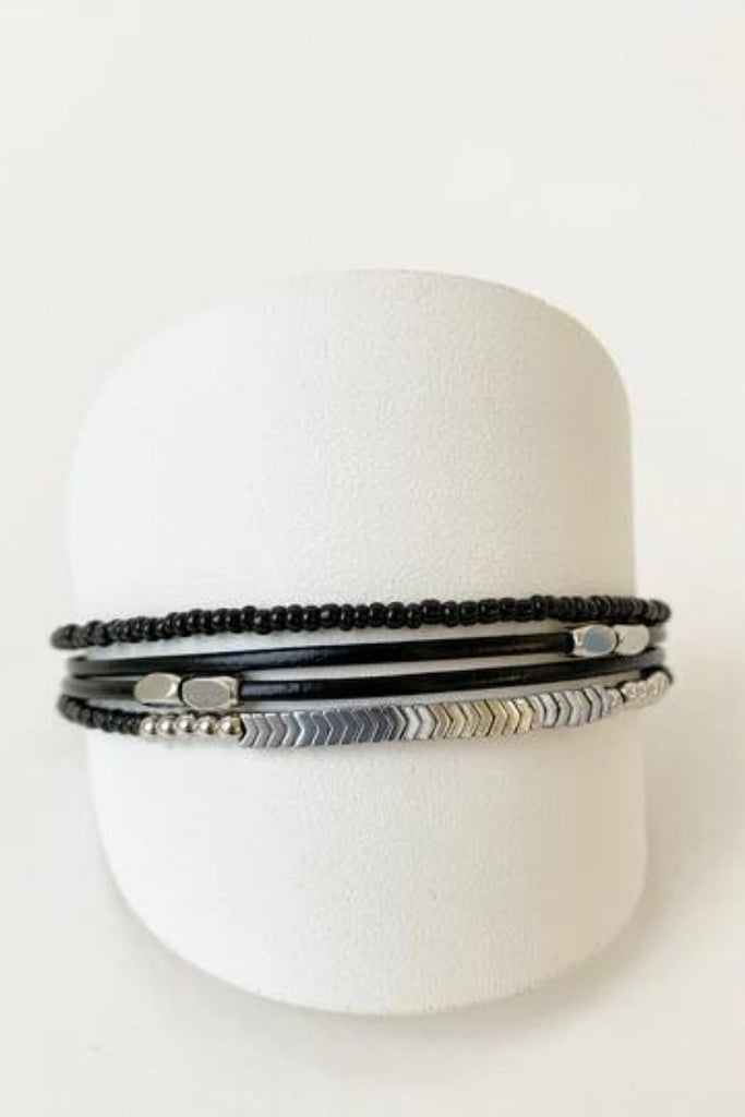 Caracol jewelry featuring a delicate single multistrand bracelet with metal beads. 