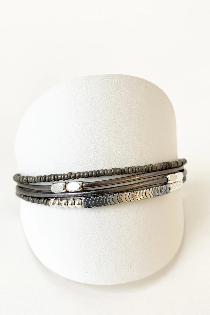 Caracol jewelry featuring a delicate single multistrand bracelet with metal beads. 