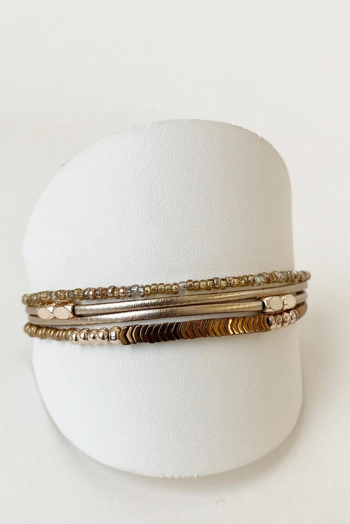 Caracol jewelry featuring a delicate single multistrand bracelet with metal beads. 