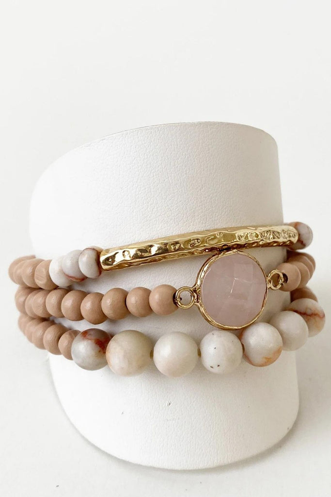 Caracol jewelry featuring a set of four bracelets with stones and metal tube