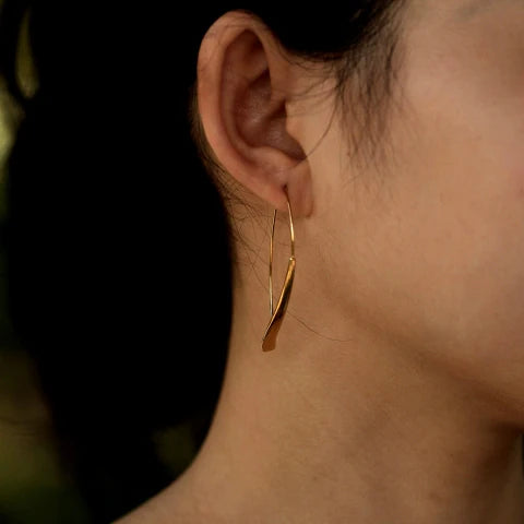 Hackney jewelry featuring a pair of gold geometric earrings