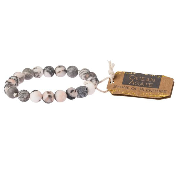 Scout jewelry featuring an elastic bracelet with beads