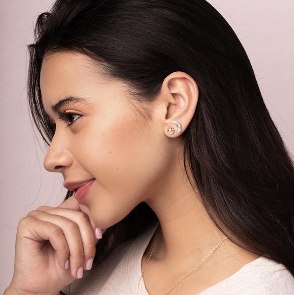 Scout jewelry featuring a pair of stud earrings