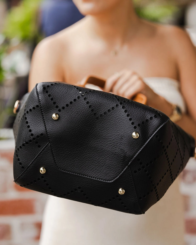 Louenhide bag featuring the 2 in 1 baby Bermuda purse with laser cut diamond shape design and an extra adjustable strap. 